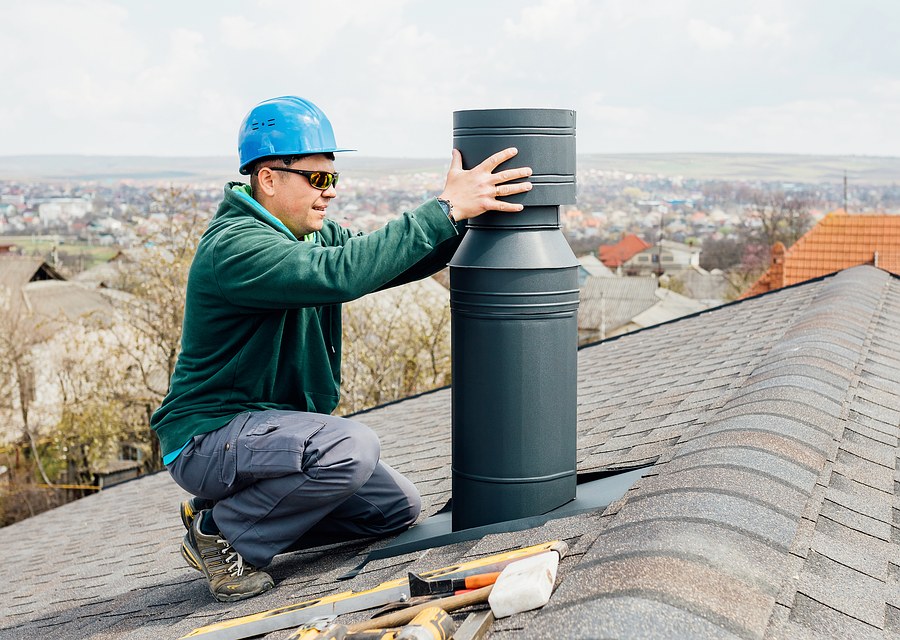Chimney sweep at work near Plantersville, TX