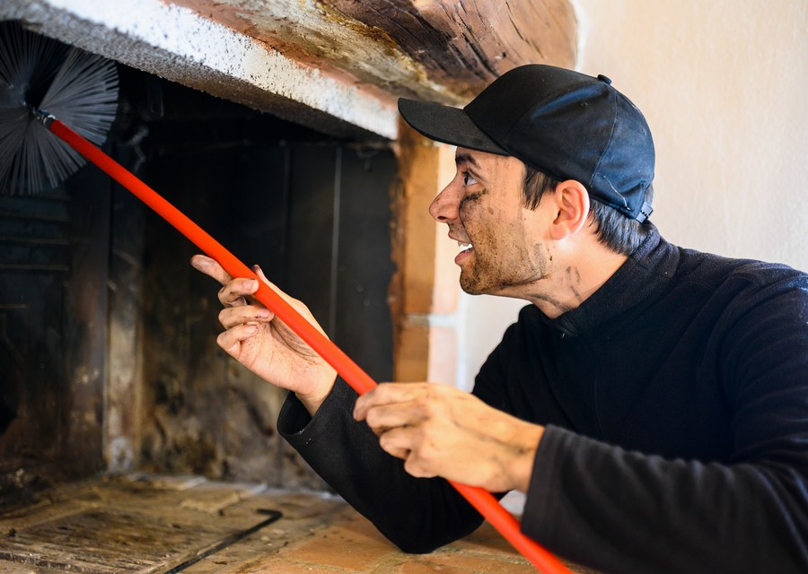 Chimney sweep at work near Billerica, MA