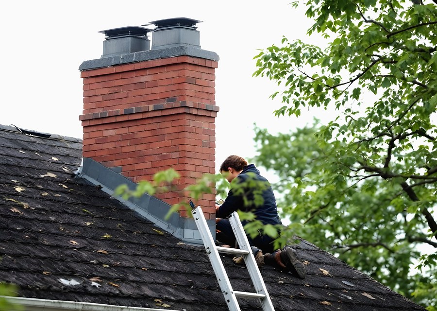 Chimney sweep at work near Conroe, TX