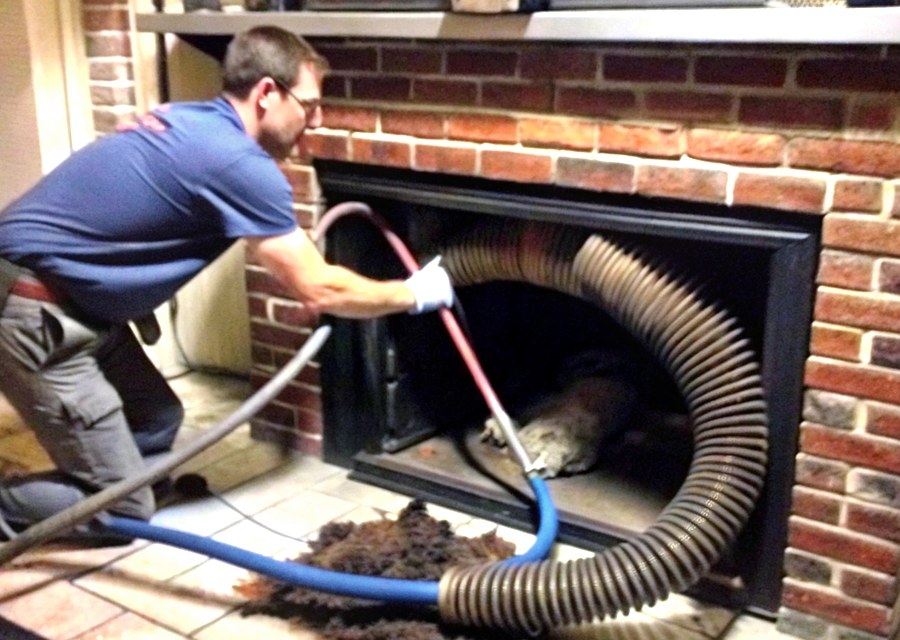 Chimney sweep at work near Amherst, MA