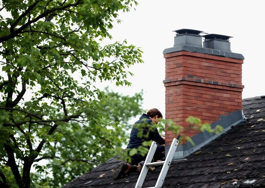 Chimney sweep at work near Hondo, TX