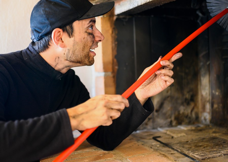 Chimney sweep at work near Crandall, TX