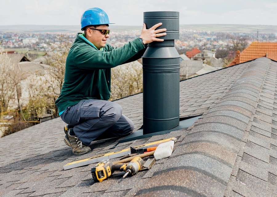Chimney sweep at work near Stockdale, TX