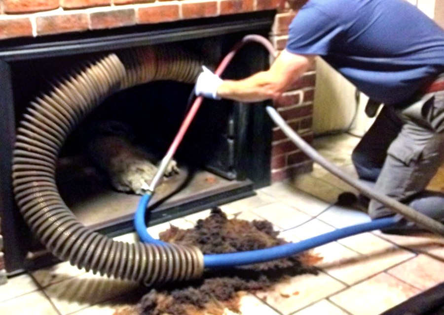 Chimney sweep at work near Needville, TX