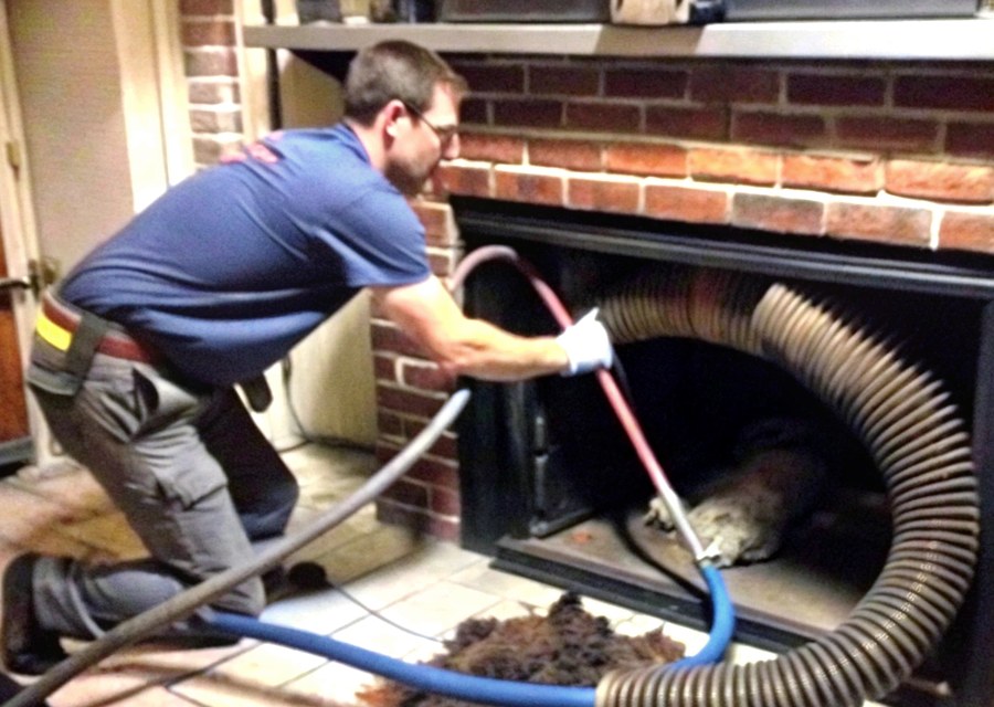 Chimney sweep at work near Hampden, MA