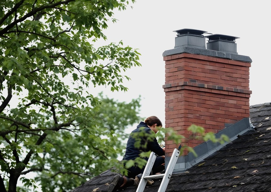 Chimney sweep at work near Deer Park, TX