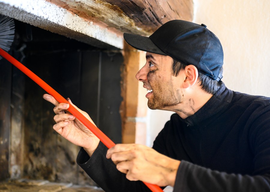 Chimney sweep at work near McDade, TX