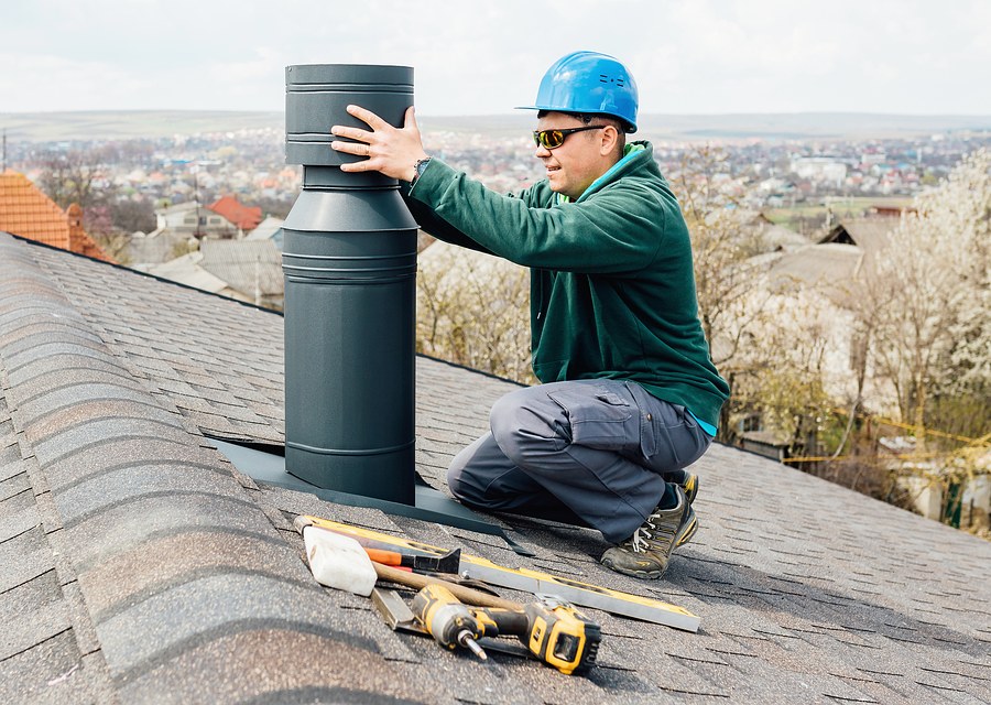 Chimney sweep at work near Buda, TX