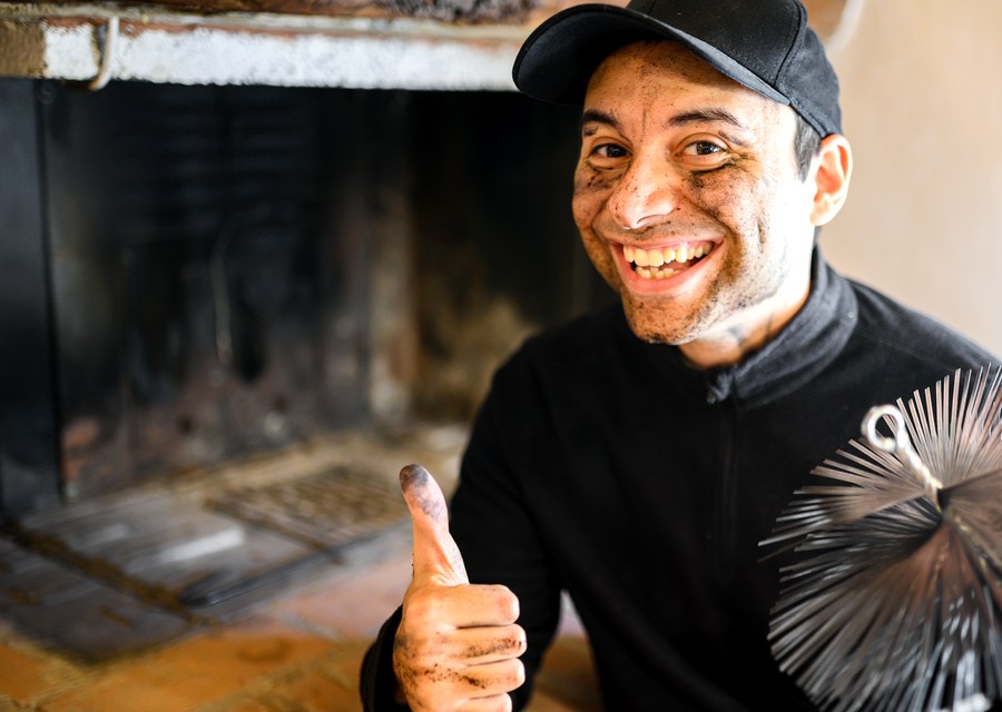 Chimney sweep at work near Willis, TX
