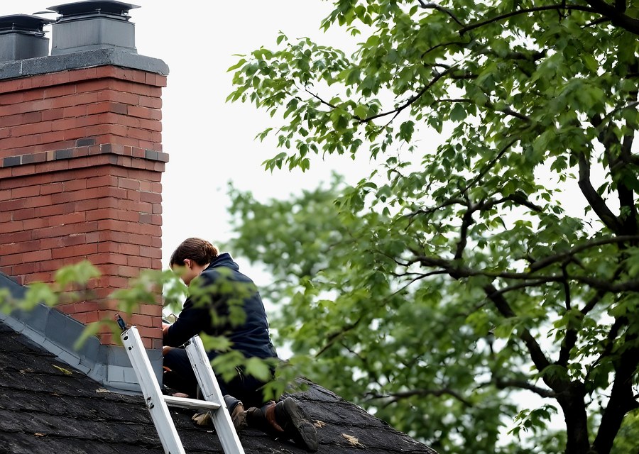 Chimney sweep at work near Carlisle, MA