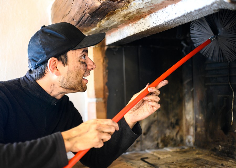 Chimney sweep at work near Canyon Lake, TX