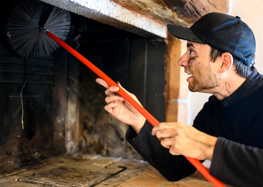 Chimney sweep at work near Tewksbury, MA
