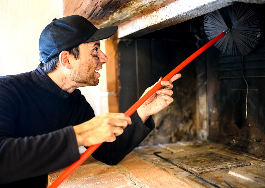Chimney sweep at work near Beasley, TX