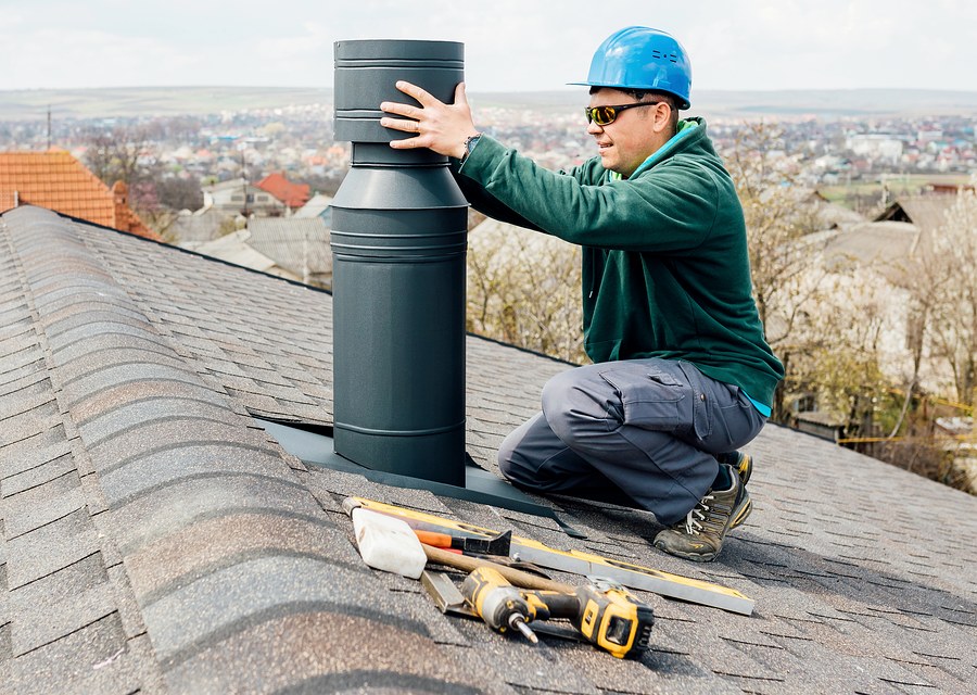 Chimney sweep at work near Maypearl, TX