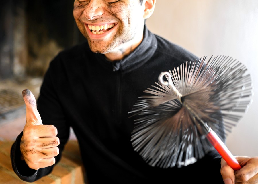 Chimney sweep at work near Peabody, MA