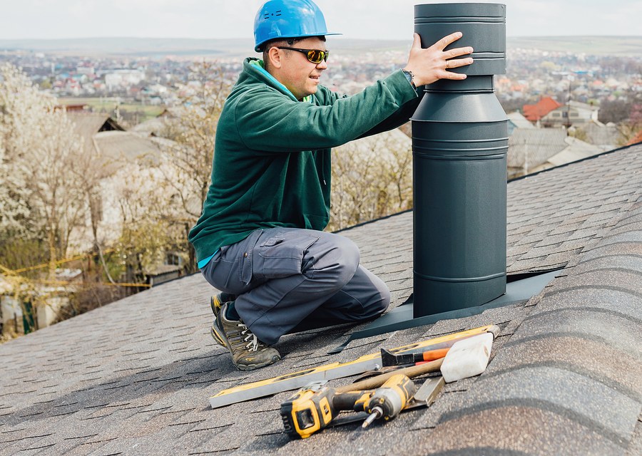Chimney sweep at work near Groton, MA