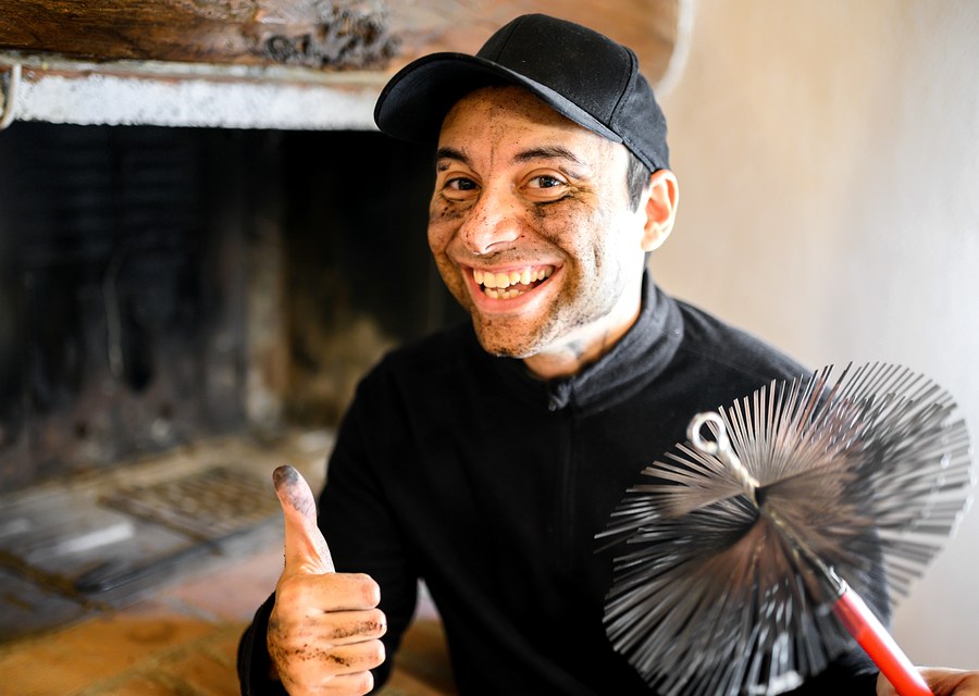 Chimney sweep at work near McQueeney, TX