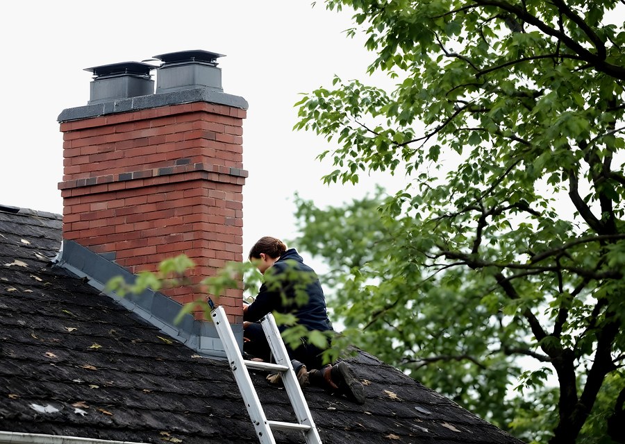 Chimney sweep at work near Southborough, MA