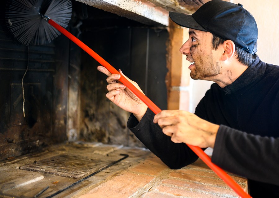 Chimney sweep at work near Helotes, TX