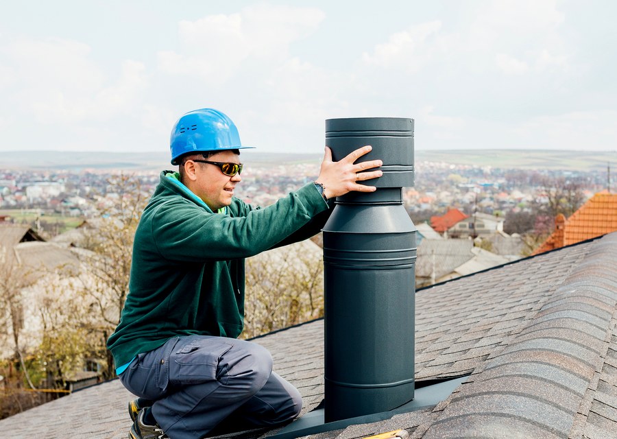 Chimney sweep at work near Splendora, TX