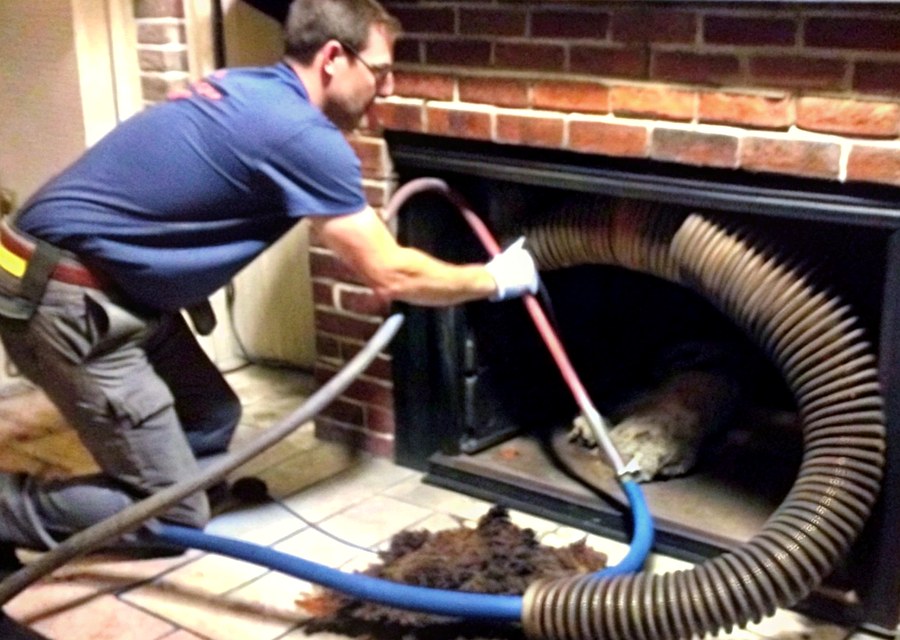 Chimney sweep at work near Pleasanton, TX