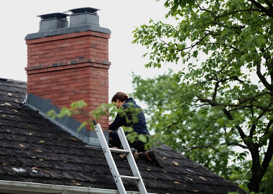Chimney sweep at work near Lowell, MA