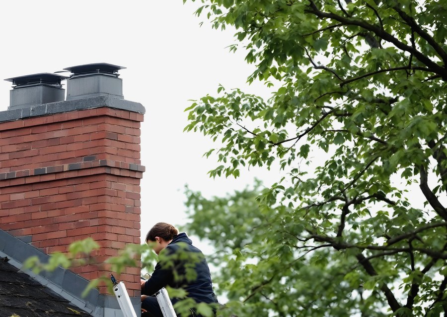 Chimney sweep at work near Methuen, MA