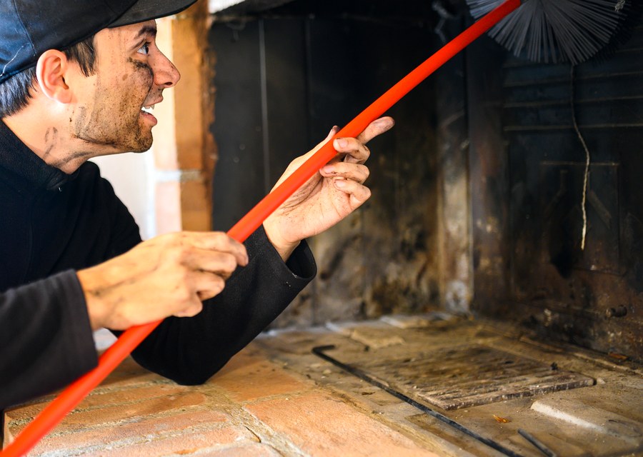 Chimney sweep at work near Burleson, TX