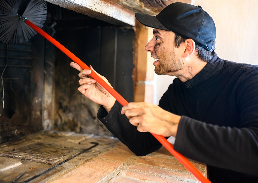Chimney sweep at work near Decatur, TX