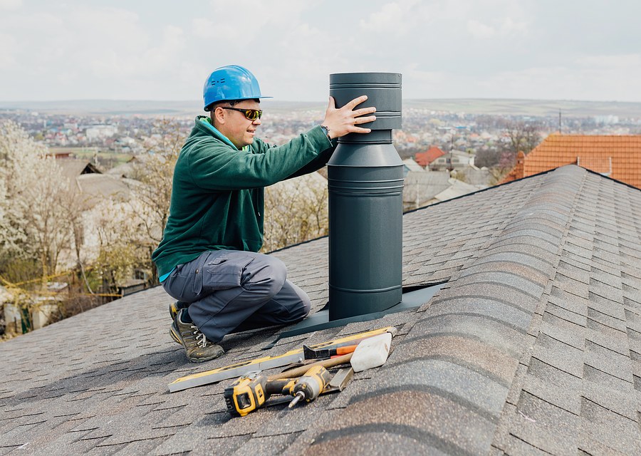 Chimney sweep at work near North Reading, MA