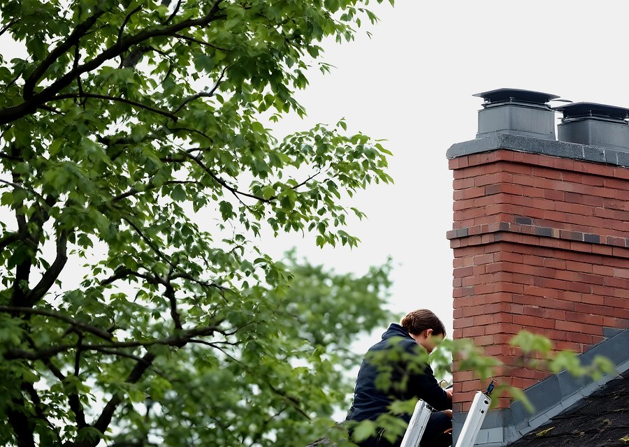 Chimney sweep at work near Dickinson, TX