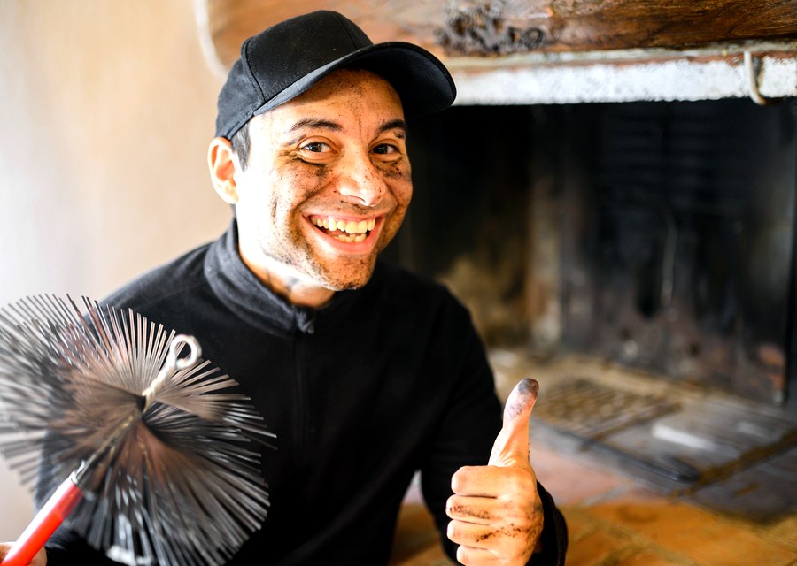 Chimney sweep at work near Hutchins, TX