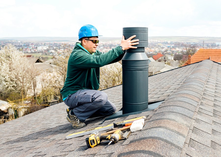 Chimney sweep at work near Haverhill, MA